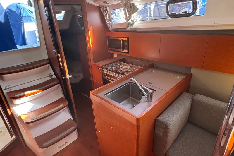 Viento Yacht Photos Pics Interior of 2018 Beneteau Oceanis 35.1 yacht with kitchen and seating area.