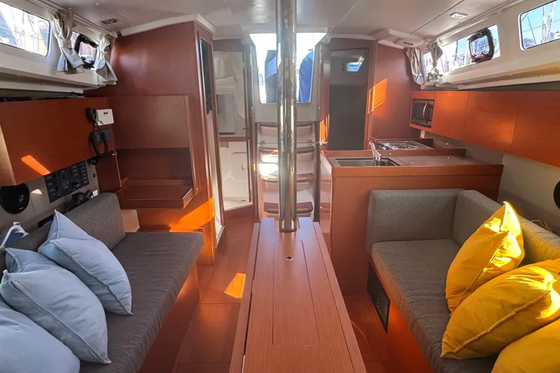 Viento Yacht Photos Pics Interior of 2018 Beneteau Oceanis 35.1 sailboat with cozy seating and modern kitchen.
