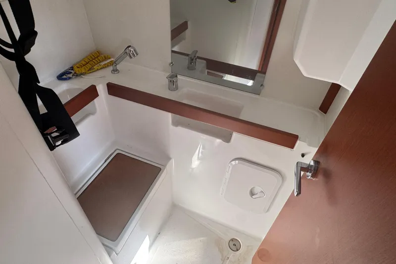 Viento Yacht Photos Pics Compact bathroom in 2018 Beneteau Oceanis 35.1 sailboat with sink and storage.