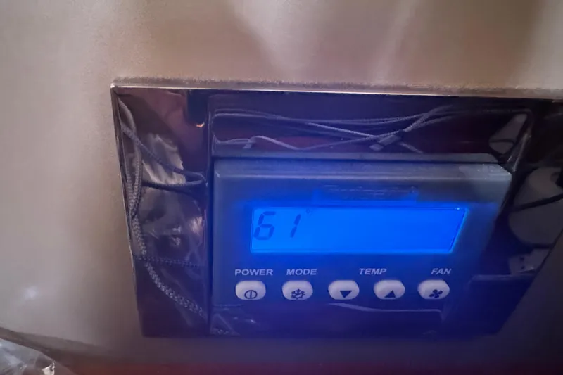 Viento Yacht Photos Pics Digital control panel on 2018 Beneteau Oceanis 35.1 yacht displaying temperature settings.