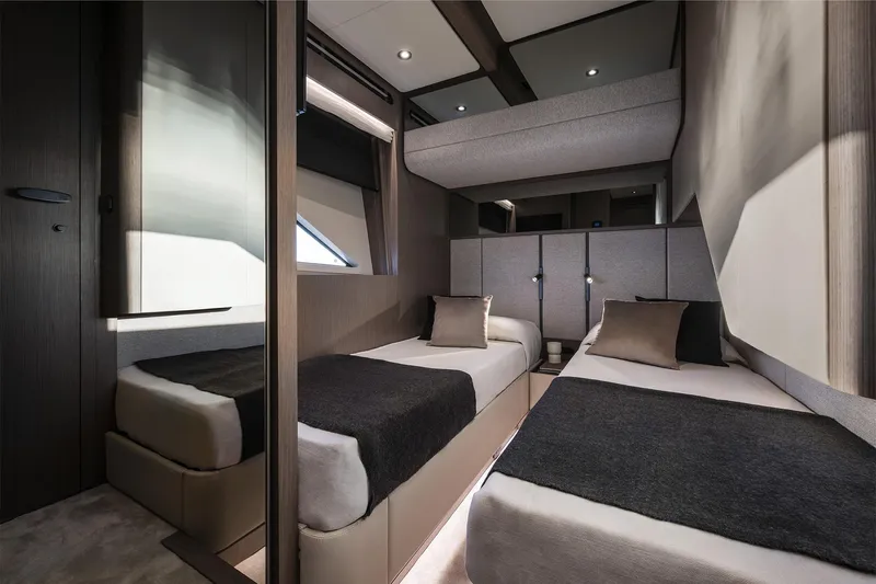  Yacht Photos Pics Luxurious twin bedroom in 2024 Ferretti Yachts 720, featuring modern design and elegant decor.