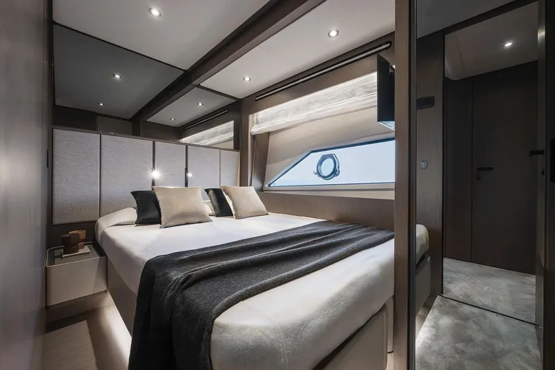 Yacht Photos Pics Luxurious bedroom interior of 2024 Ferretti Yachts 720 with modern design and elegant furnishings.