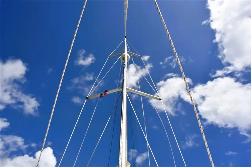  Yacht Photos Pics Mast of a Beneteau Oceanis 473 sailboat against blue sky.