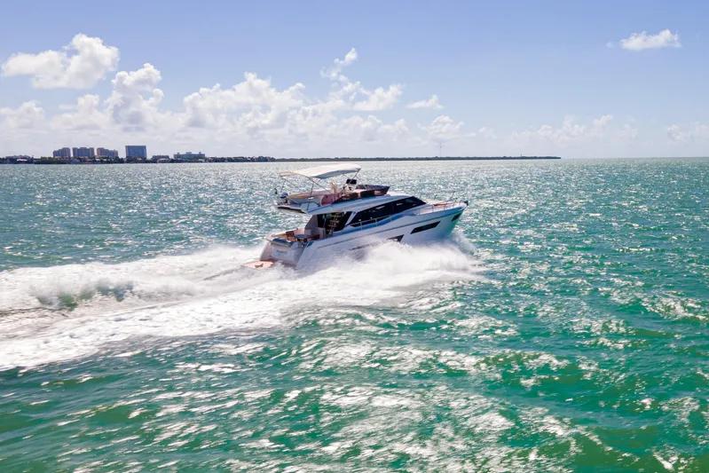 Avanti Yacht Photos Pics 2022 Ferretti Yachts 500 cruising on open sea under clear blue sky.