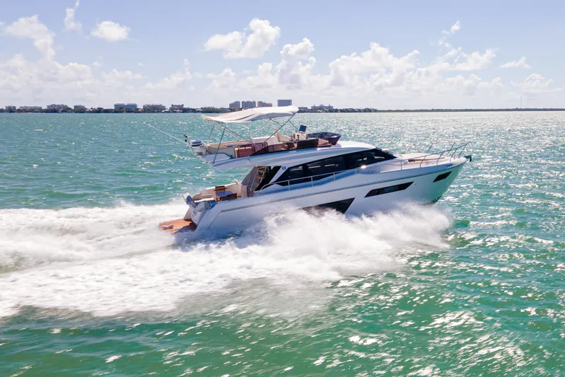 Avanti Yacht Photos Pics 2022 Ferretti Yachts 500 cruising on open water under a clear sky.