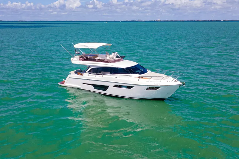 Avanti Yacht Photos Pics 2022 Ferretti Yachts 500 cruising on turquoise waters under a clear sky.