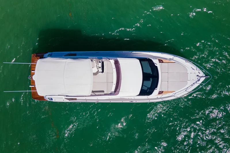 Avanti Yacht Photos Pics Aerial view of 2022 Ferretti Yachts 500 on vibrant green water.