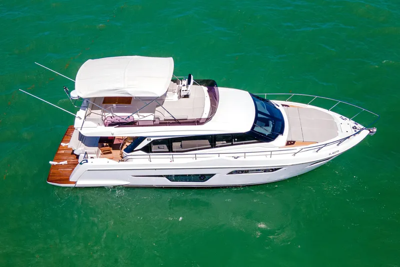 Avanti Yacht Photos Pics 2022 Ferretti Yachts 500 cruising on clear turquoise waters.