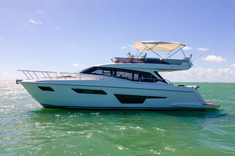 Avanti Yacht Photos Pics 2022 Ferretti Yachts 500 cruising on calm ocean waters under clear blue skies.