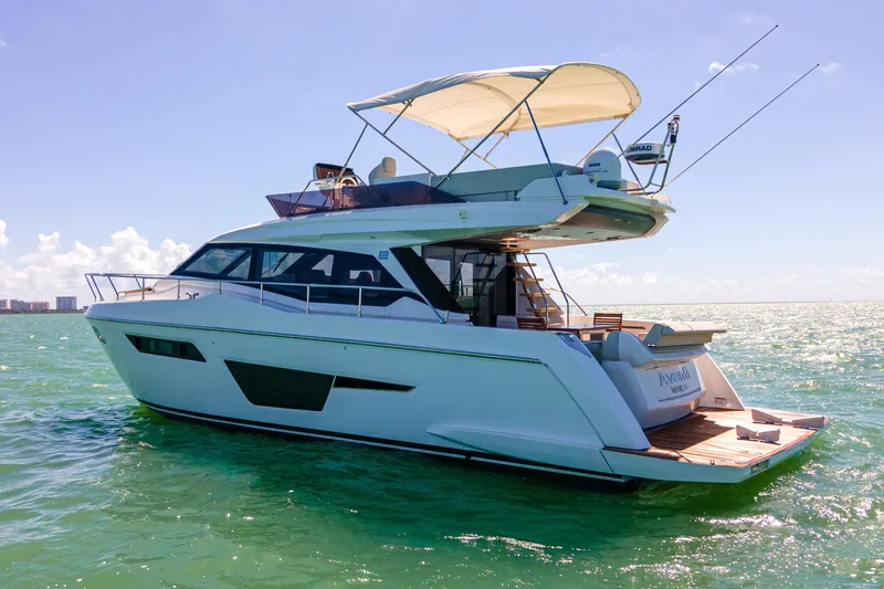 Avanti Yacht Photos Pics 2022 Ferretti Yachts 500 cruising on open water under clear skies.