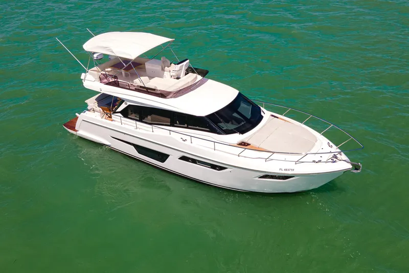 Avanti Yacht Photos Pics 2022 Ferretti Yachts 500 cruising on clear turquoise waters.