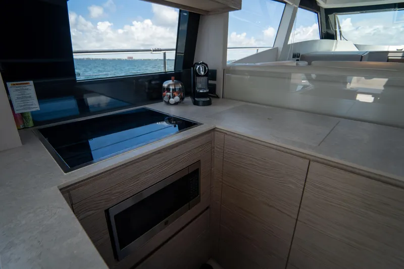 Avanti Yacht Photos Pics Modern kitchen interior of 2022 Ferretti Yachts 500 with ocean view.