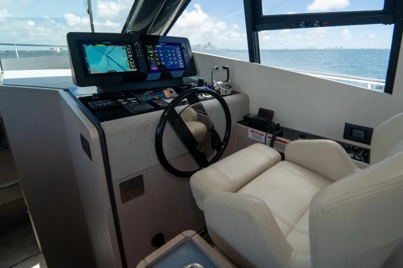 Avanti Yacht Photos Pics Helm of 2022 Ferretti Yachts 500 with navigation screens and leather seating.