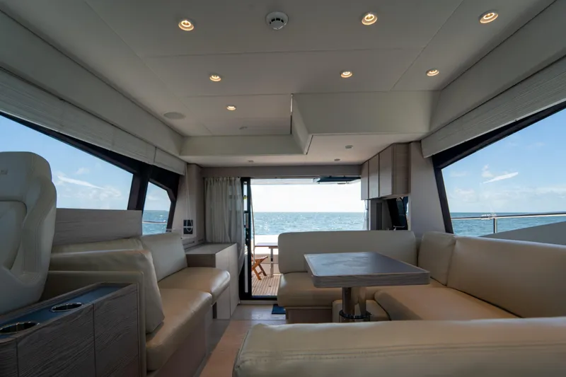 Avanti Yacht Photos Pics Luxurious interior of 2022 Ferretti Yachts 500 with ocean view through large windows.