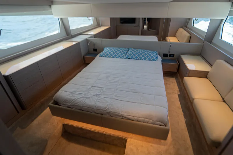 Avanti Yacht Photos Pics Luxurious bedroom interior of 2022 Ferretti Yachts 500 with modern design and large windows.