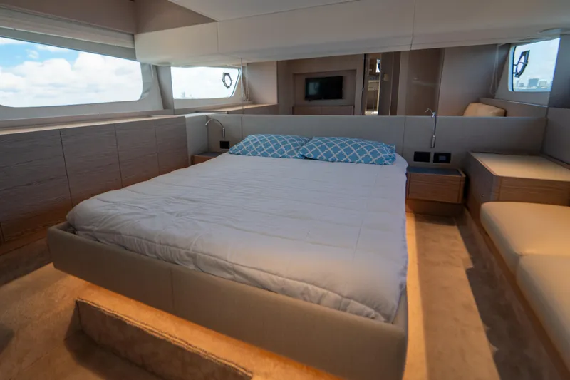 Avanti Yacht Photos Pics Luxurious bedroom interior of 2022 Ferretti Yachts 500 with modern design and large windows.