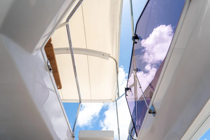 Avanti Yacht Photos Pics 2022 Ferretti Yachts 500, view of deck canopy and sky through glass.