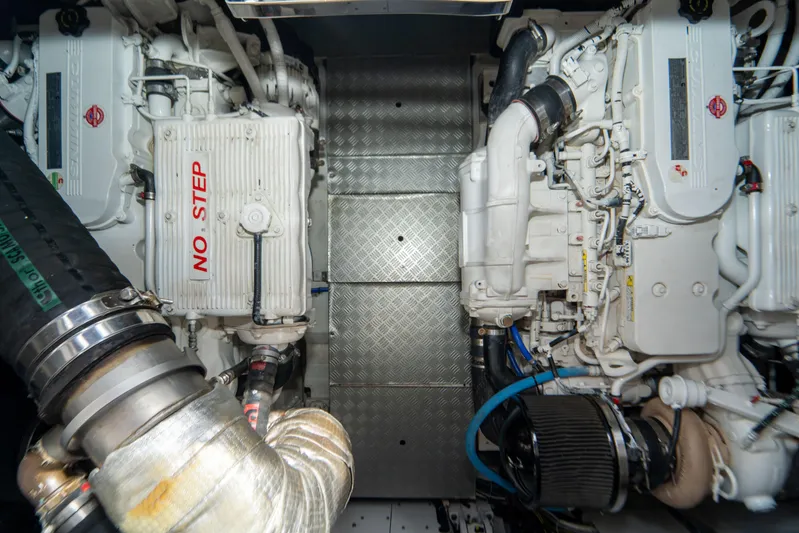 Avanti Yacht Photos Pics Engine room of 2022 Ferretti Yachts 500, featuring dual engines and "No Step" warning.