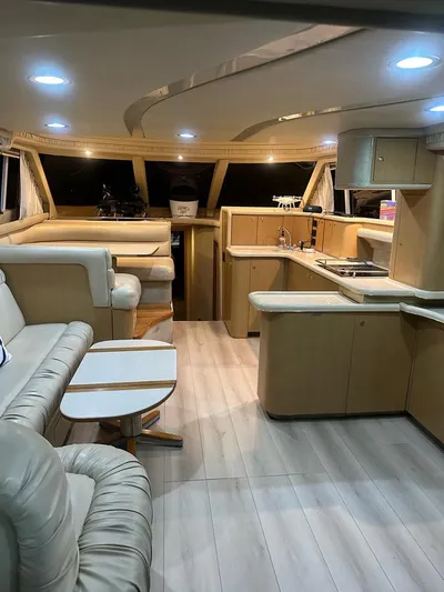 Chiquimu Yacht Photos Pics Luxurious interior of 2000 Sea Ray 480 Sedan Bridge yacht with modern furnishings.