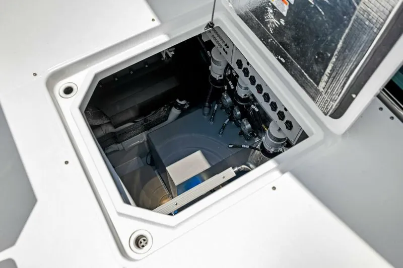 Mint 2 Bee Yacht Photos Pics Engine compartment of 2022 Cruisers Yachts 50 Cantius, showcasing mechanical components.