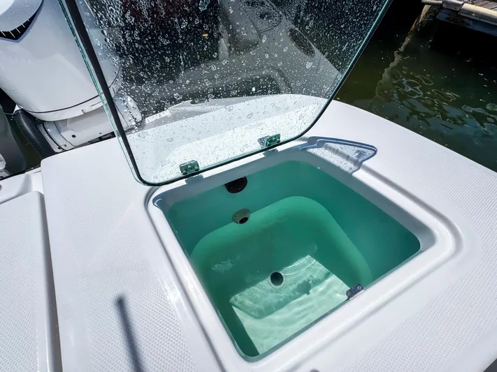  Yacht Photos Pics Open livewell on 2025 Edgewater 370CC boat, showcasing clean design and functionality.