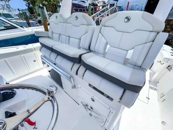  Yacht Photos Pics 2025 Edgewater 370CC boat with luxurious white seating and sleek design.
