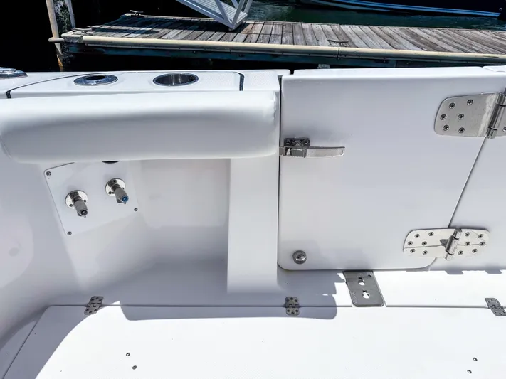  Yacht Photos Pics 2025 Edgewater 370CC boat interior with stainless steel fixtures and dock view.