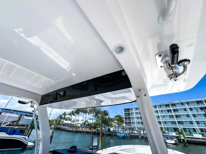  Yacht Photos Pics 2025 Edgewater 370CC boat interior with marina view, featuring sleek design and modern amenities.