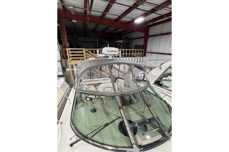 Good Juju Yacht Photos Pics 2005 Sea Ray 360 Sundancer in storage, featuring Garmin equipment and sleek design.