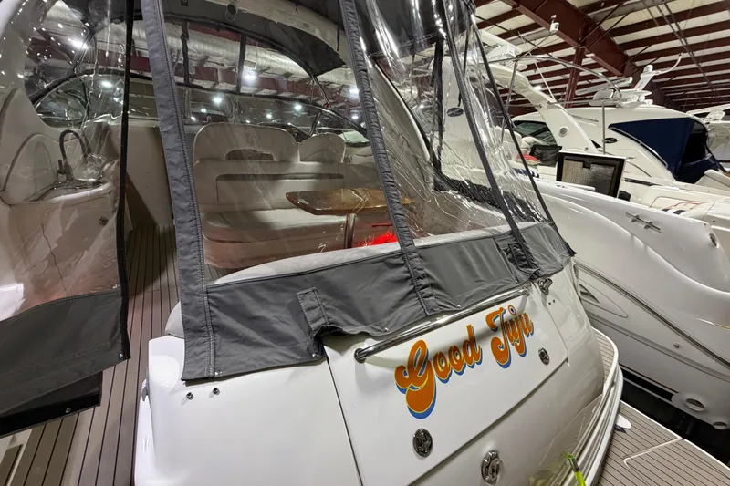 Good Juju Yacht Photos Pics 2005 Sea Ray 360 Sundancer yacht with covered seating area in marina.