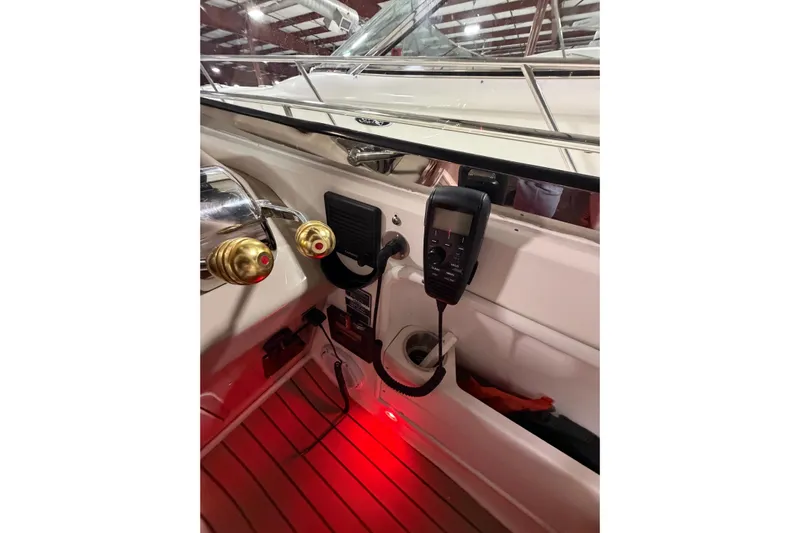 Good Juju Yacht Photos Pics 2005 Sea Ray 360 Sundancer helm with controls and communication device.