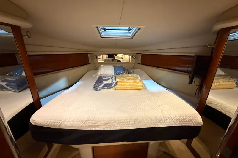 Good Juju Yacht Photos Pics Luxurious cabin interior of 2005 Sea Ray 360 Sundancer yacht with cozy bedding.