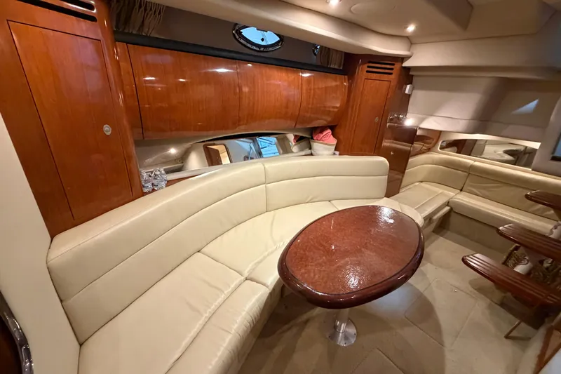 Good Juju Yacht Photos Pics Luxurious interior of 2005 Sea Ray 360 Sundancer yacht with elegant seating and wooden finishes.
