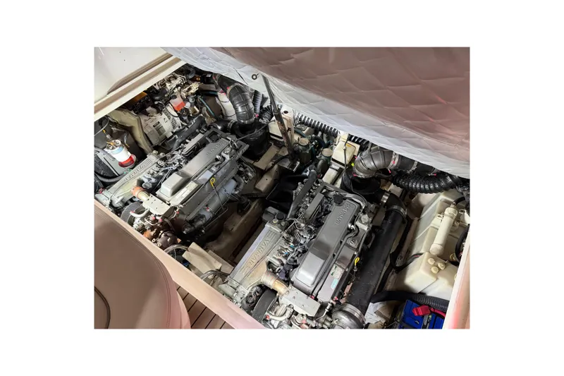 Good Juju Yacht Photos Pics Engine compartment of a 2005 Sea Ray 360 Sundancer boat, showcasing dual engines.