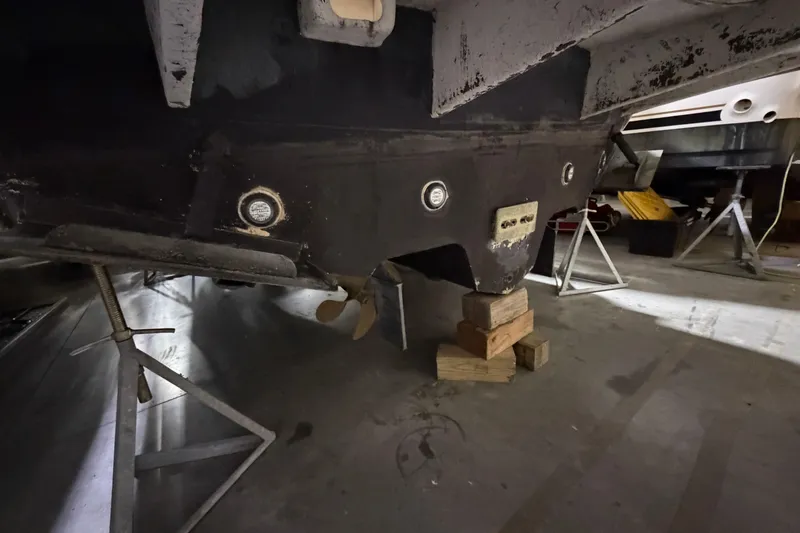 Good Juju Yacht Photos Pics 2005 Sea Ray 360 Sundancer boat hull on stands in a storage facility.