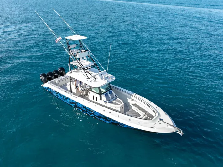 Dirty Deeds Yacht Photos Pics 2014 Hydra-Sports 42 Custom Siesta boat on clear blue water.