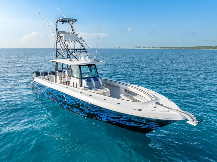Dirty Deeds Yacht Photos Pics 2014 Hydra-Sports 42 Custom Siesta boat on clear blue ocean water.