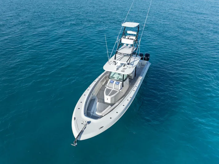 Dirty Deeds Yacht Photos Pics 2014 Hydra-Sports 42 Custom Siesta boat on clear blue water.