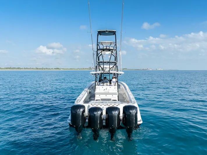 Dirty Deeds Yacht Photos Pics 2014 Hydra-Sports 42 Custom Siesta boat with four engines on open water.