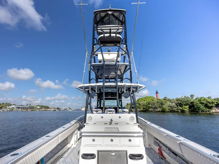 Dirty Deeds Yacht Photos Pics 2014 Hydra-Sports 42 Custom Siesta boat on calm water, clear sky background.