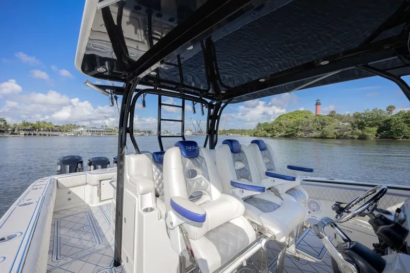 Dirty Deeds Yacht Photos Pics 2014 Hydra-Sports 42 Custom Siesta boat interior with white seating and scenic water view.