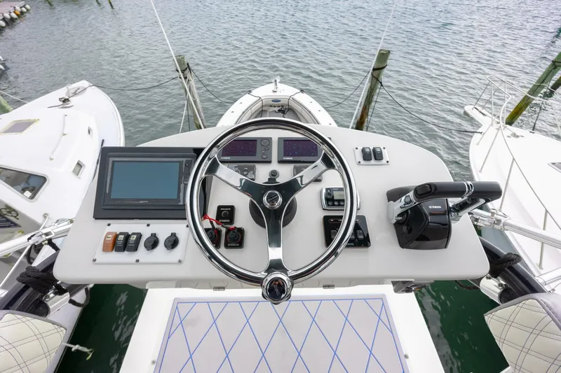 Dirty Deeds Yacht Photos Pics 2014 Hydra-Sports 42 Custom Siesta helm with advanced controls and navigation system.