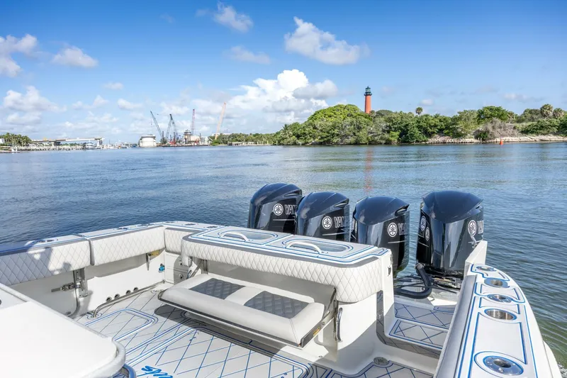 Dirty Deeds Yacht Photos Pics 2014 Hydra-Sports 42 Custom Siesta boat with four engines, scenic waterfront view.