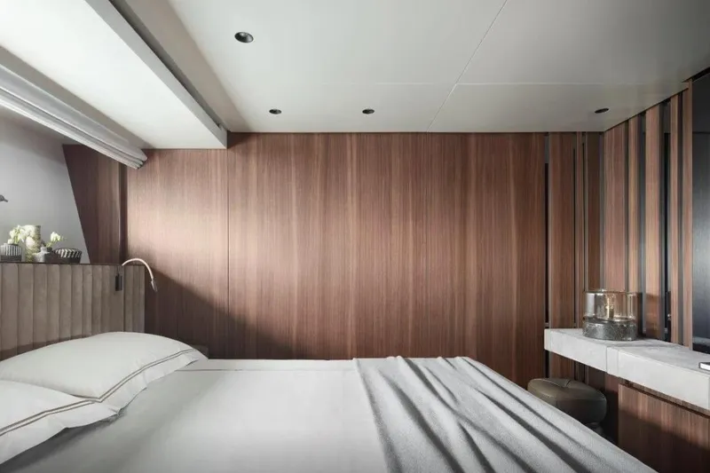  Yacht Photos Pics Luxurious bedroom interior of 2021 Sanlorenzo SL90A yacht with modern wood paneling.