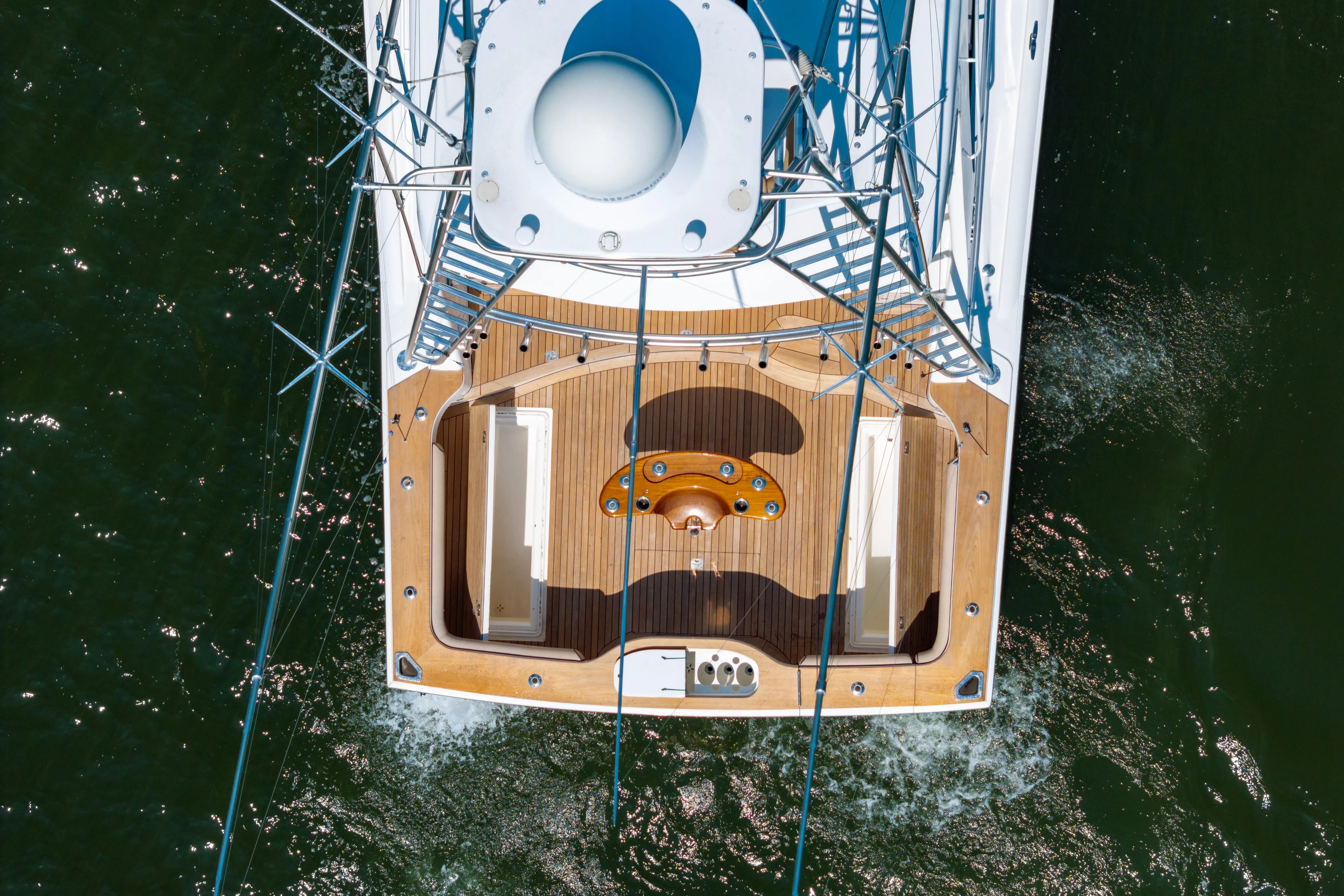  Yacht Photos Pics Aerial view of 2012 Cabo 44 Hardtop Express yacht on water.