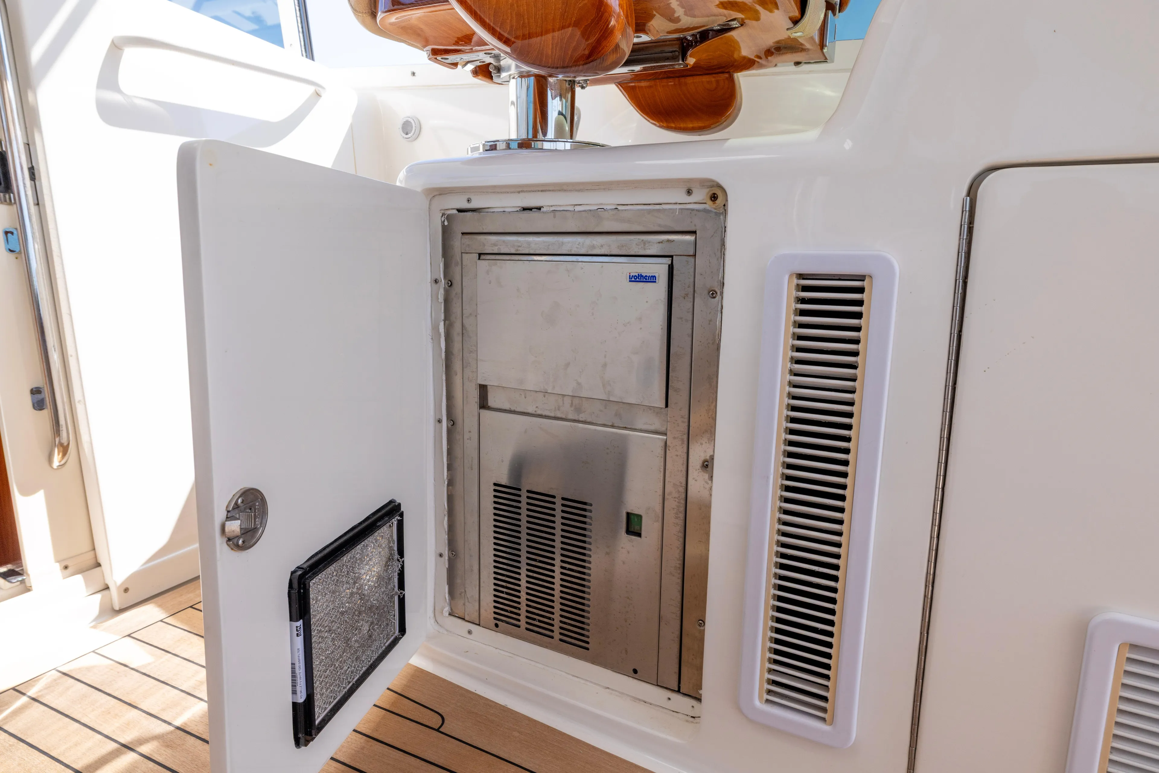  Yacht Photos Pics Open storage compartment on 2012 Cabo 44 Hardtop Express yacht with visible equipment.