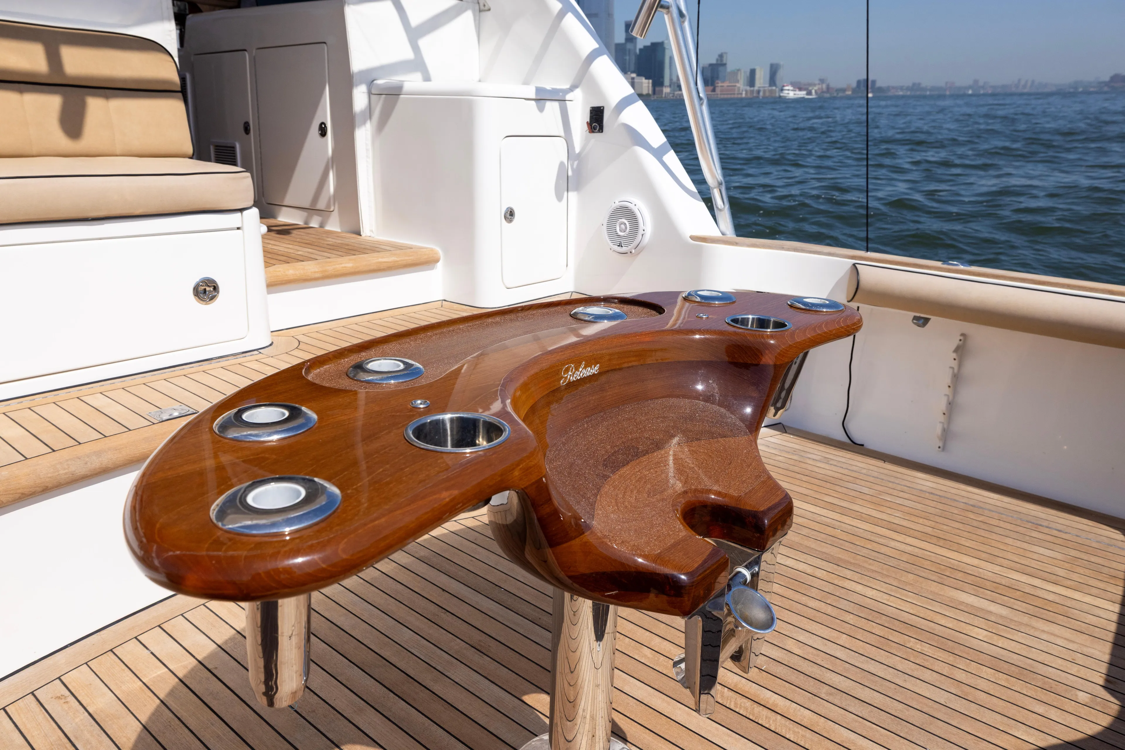  Yacht Photos Pics Luxury deck of 2012 Cabo 44 Hardtop Express yacht with custom wooden table.