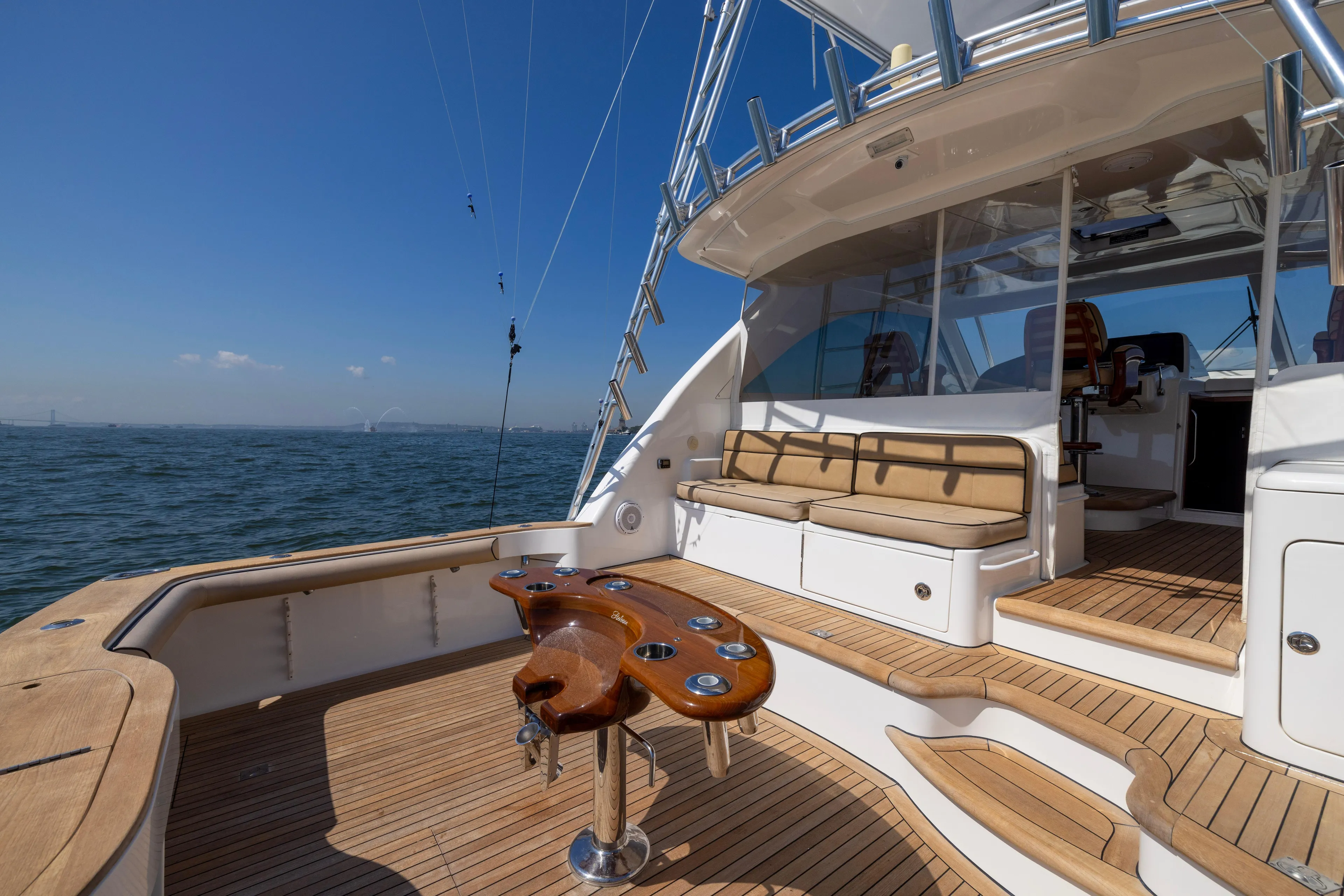  Yacht Photos Pics 2012 Cabo 44 Hardtop Express yacht with spacious deck and seating area.