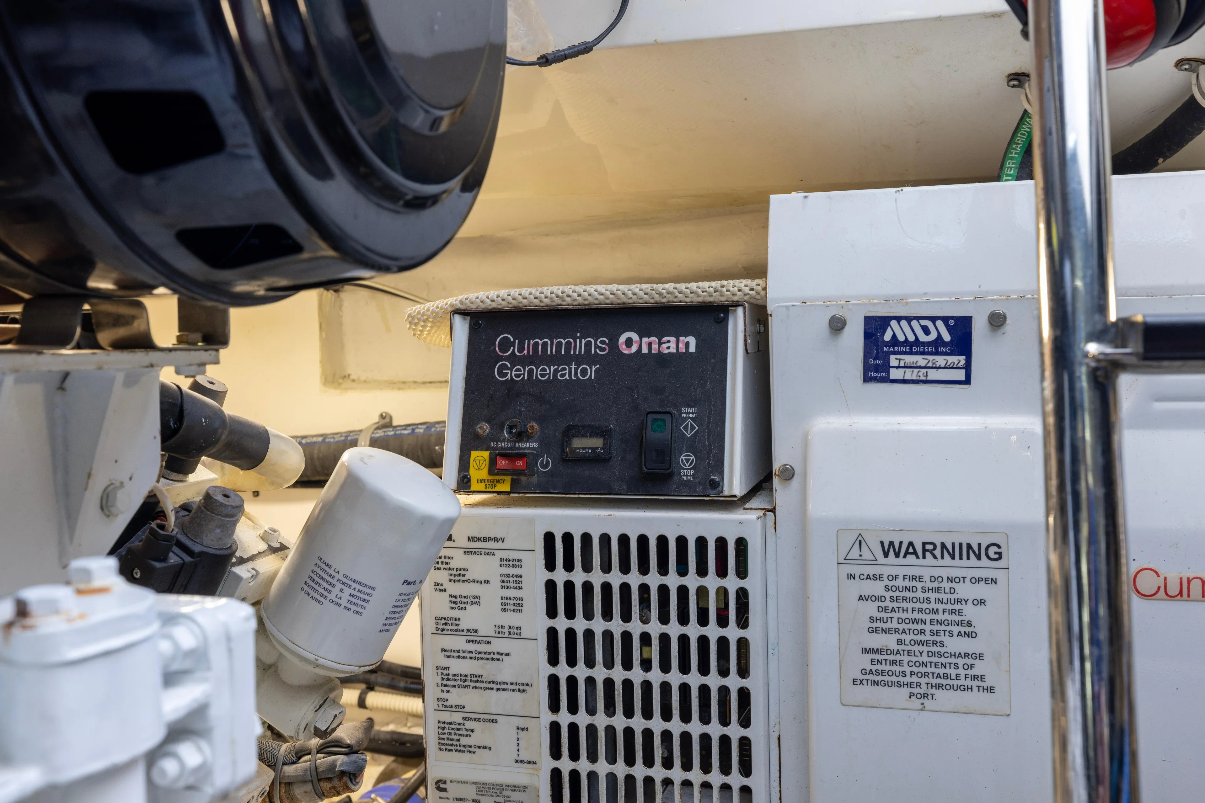  Yacht Photos Pics Engine room of 2012 Cabo 44 Hardtop Express with Cummins Onan generator.