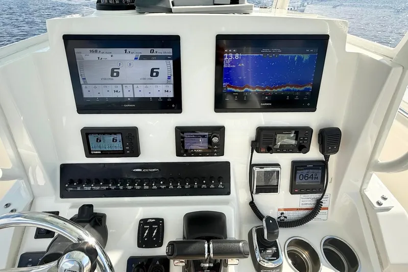  Yacht Photos Pics 2020 Cobia 301 Center Console dashboard with Garmin displays and navigation controls.